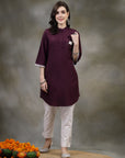 Purple cotton kurti with floral embroidery and lace-trimmed bell sleeves