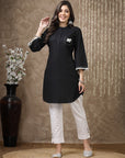 Black cotton kurti with floral embroidery and lace-trimmed bell sleeves