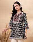 Ikat Printed A-Line Cotton Cambric Kurti with Embroidery