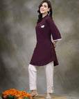 Purple cotton kurti with floral embroidery and lace-trimmed bell sleeves