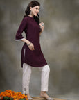 Purple cotton kurti with floral embroidery and lace-trimmed bell sleeves
