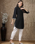 Black cotton kurti with floral embroidery and lace-trimmed bell sleeves