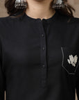 Black cotton kurti with floral embroidery and lace-trimmed bell sleeves